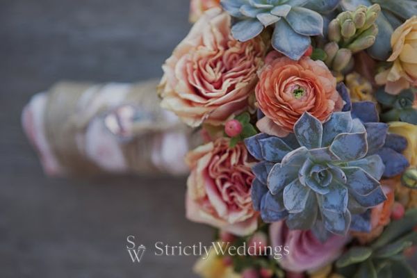garden roses and coffee bean berries in shades of coral peach